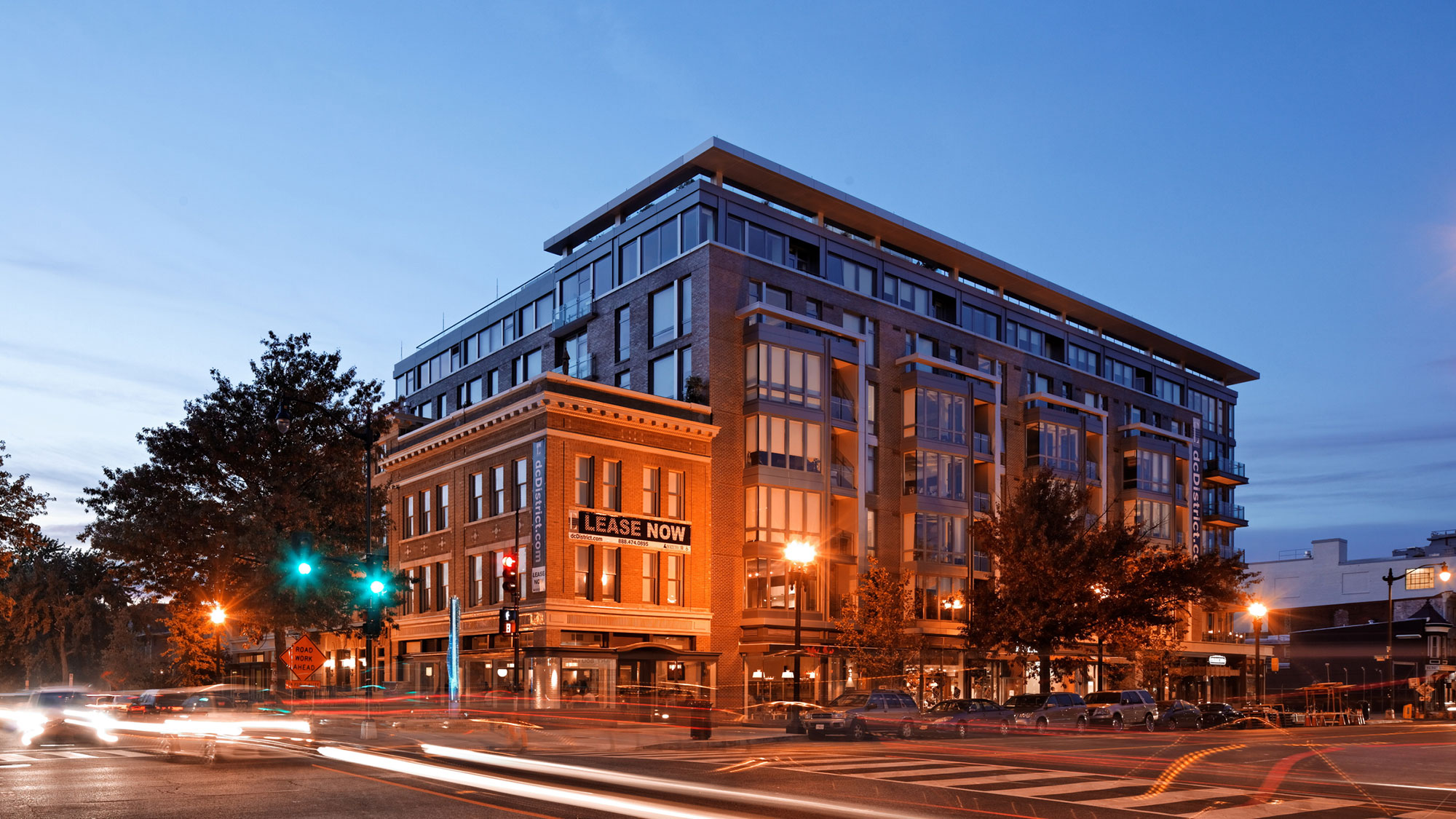 A sidewalk view of the D.C District building at night