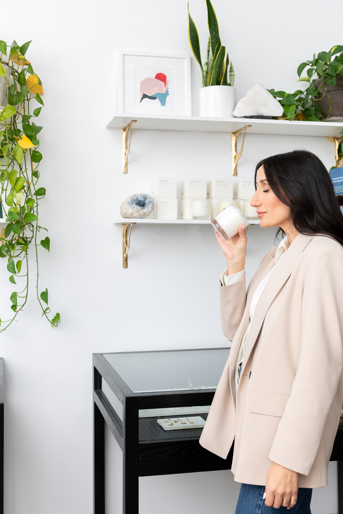 A woman in the grey suit shopping in a retail destination